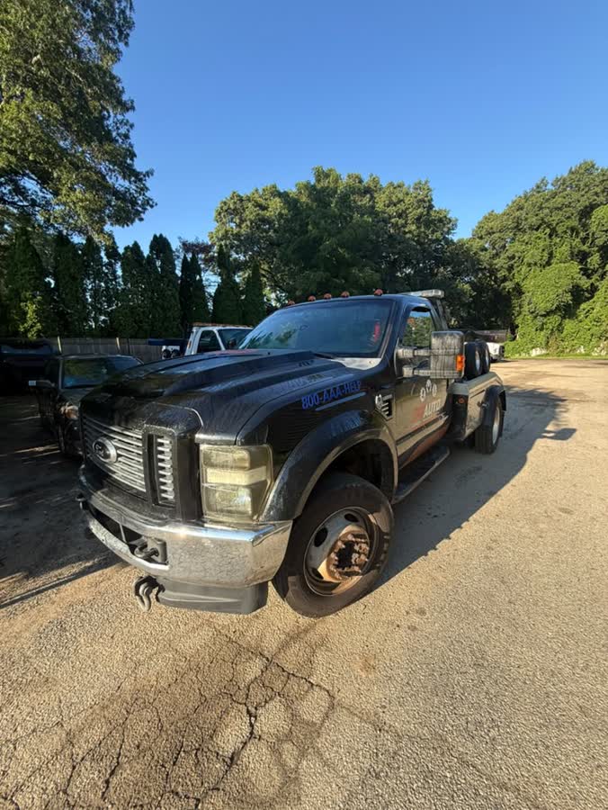 Black Ford wrecker, front view