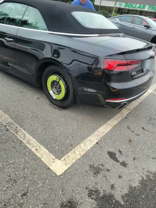 Black convertible with a spare wheel fitted